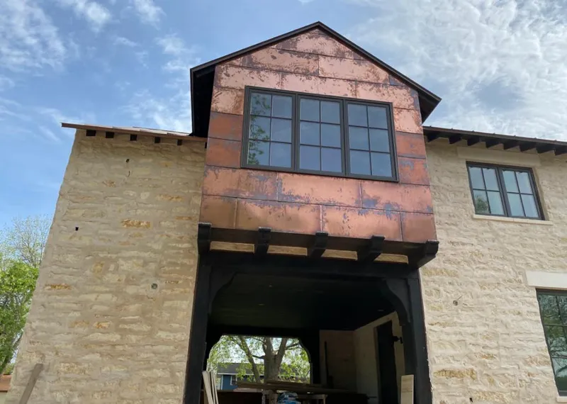 Copper metal panel facade on a stone building for Skylight Installation in Voorhees